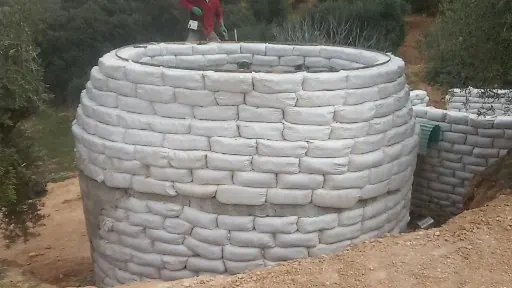 Round earth wall course under construction